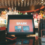 spark epos system in front of qr scanner and PDQs in a restaurant